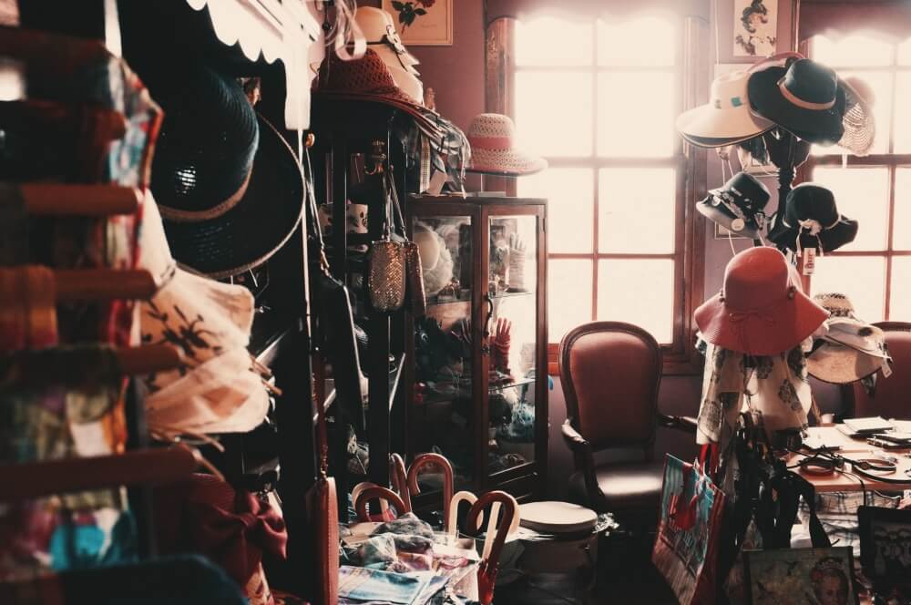 second hand shop photo with old hats and trinkets