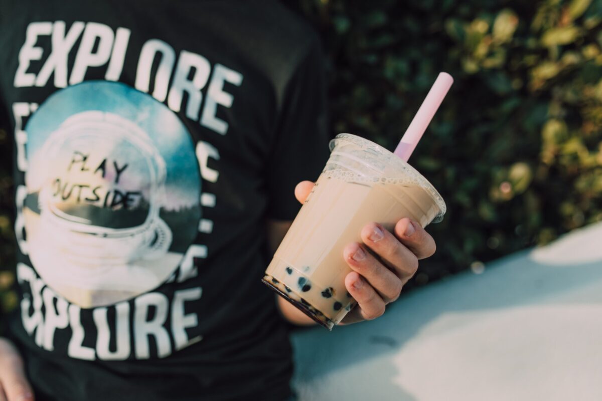 man holding bubble tea