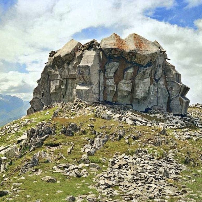 photograph of a hidden swiss bunker in the mountains